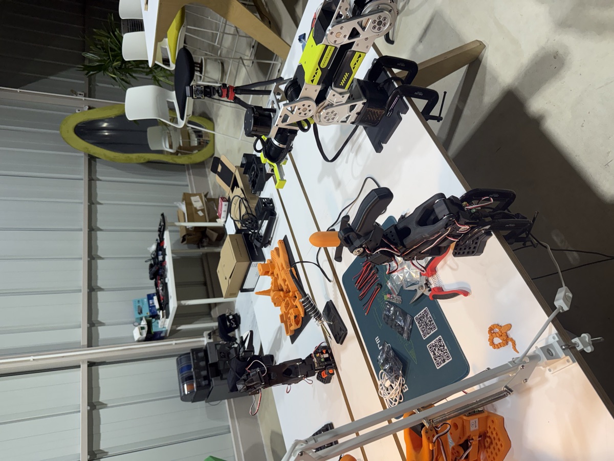 Workbench with robot arms, a LiDAR unit, 3D printed parts and a soldering station
